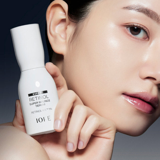 IOPE Retinol Super Bounce Serum bottle held by a lady