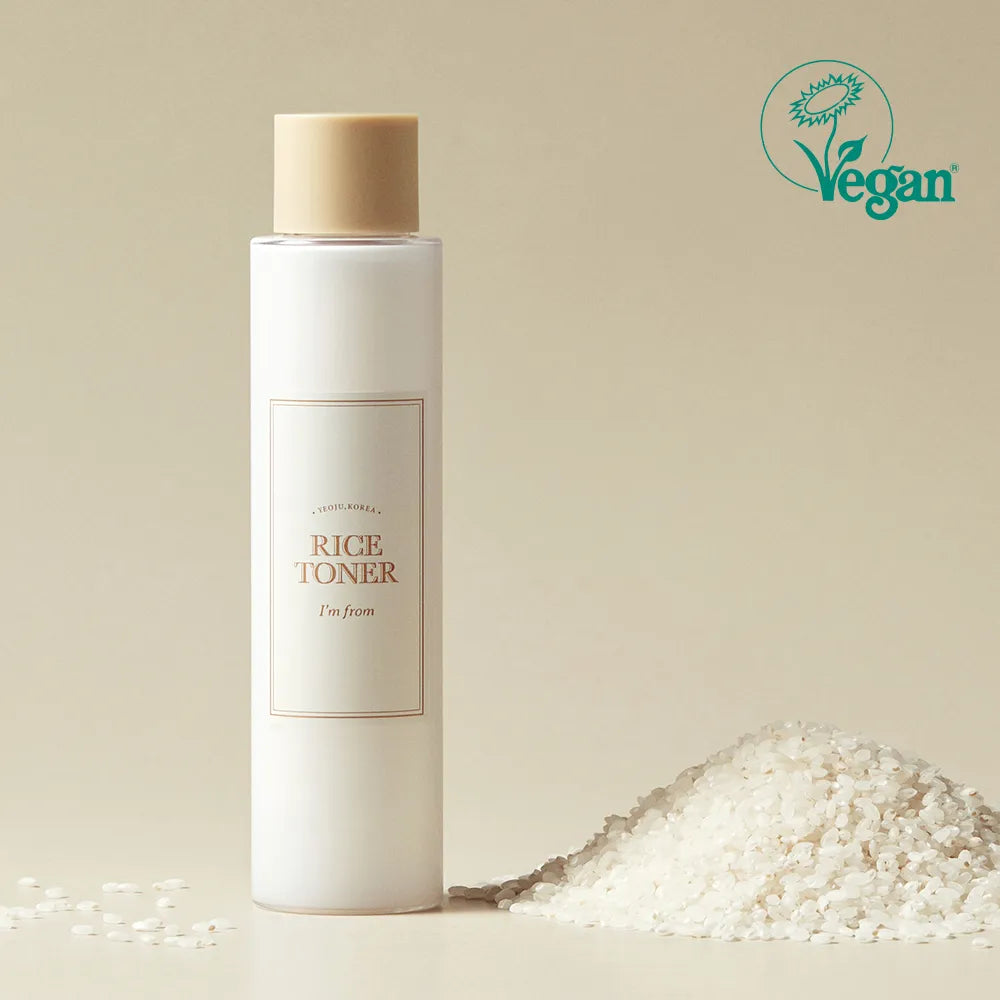 I'm from Rice Toner bottle with a beige cap on a beige background, featuring a Vegan logo.