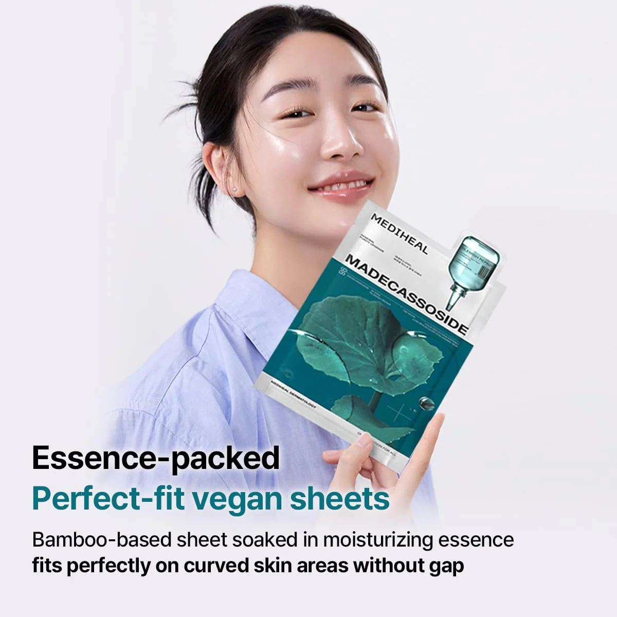 Woman holding a MEDIHEAL Madecassoside Essential Mask Sheet Blemish Repair with text highligting masks are vegan friendly made from bamboo