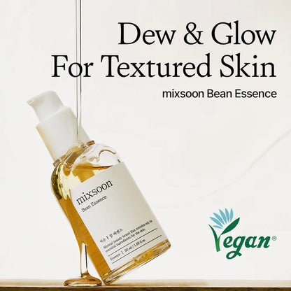 Bottle of mixsoon Bean Essence with 'Dew & Glow For Textured Skin' text and Vegan logo on a light background
