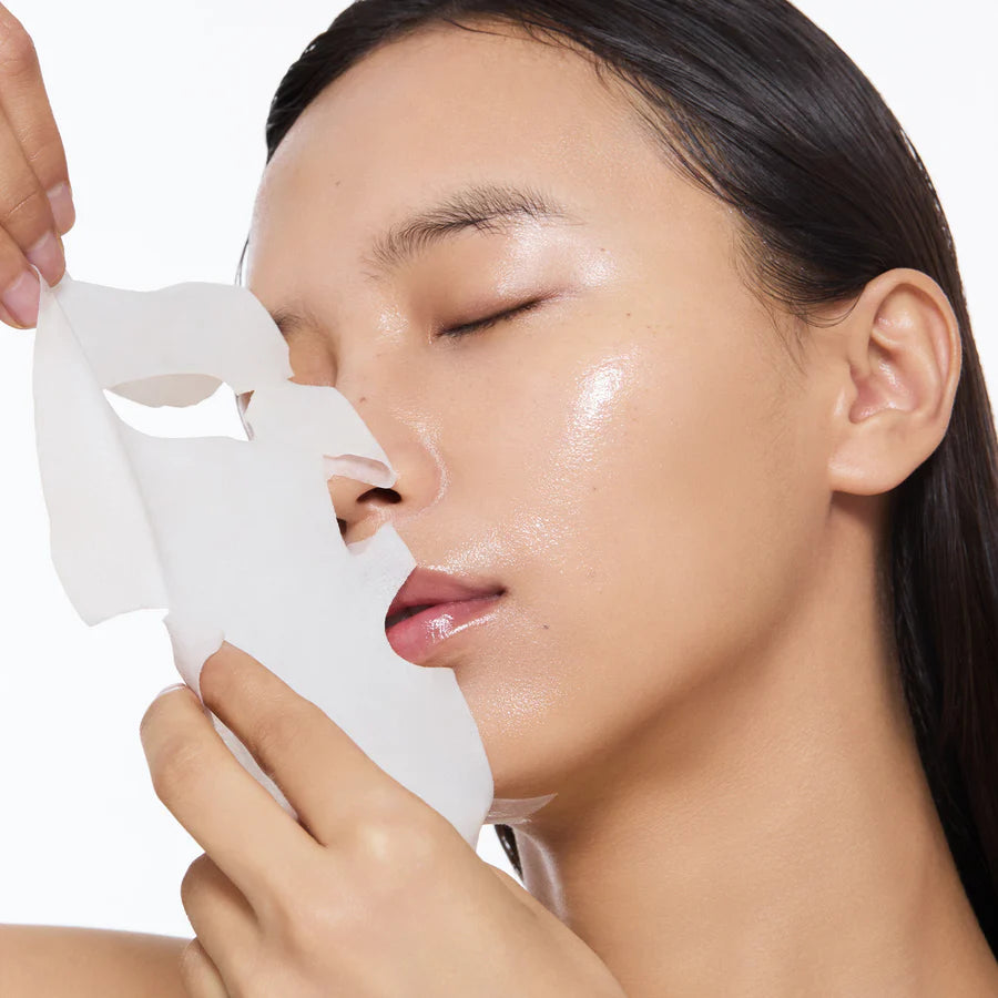 Person taking off Torriden Dive In Low Molecular Hyaluronic Acid Mask 