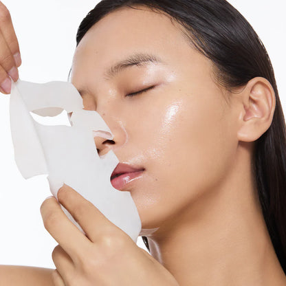 Person taking off Torriden Dive In Low Molecular Hyaluronic Acid Mask 